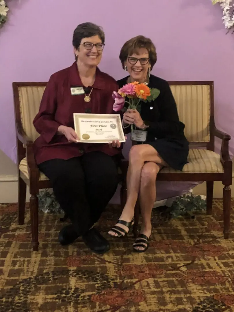 Roswell Roswell Garden Club president Debbie Vann receives one of their many first-place awards from President Lisa Hall, Augusta 2025