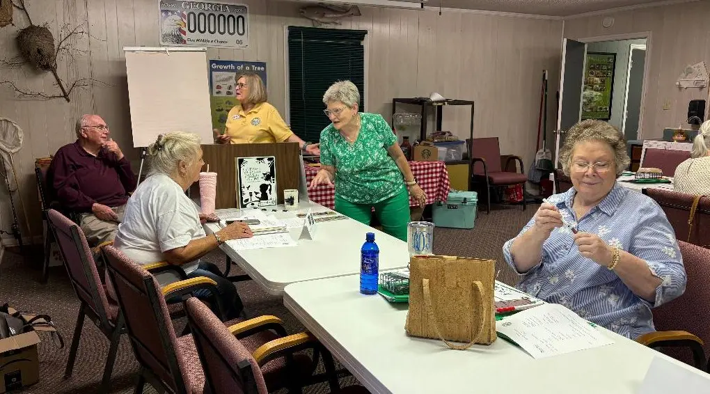 Terry Jones and Molly Kimler prepare district directors and CWP chairs for a fun morning. CWP chair Jean O'Shields assists Peggy Wililiams,  and Bonnie Dudley gets busy.