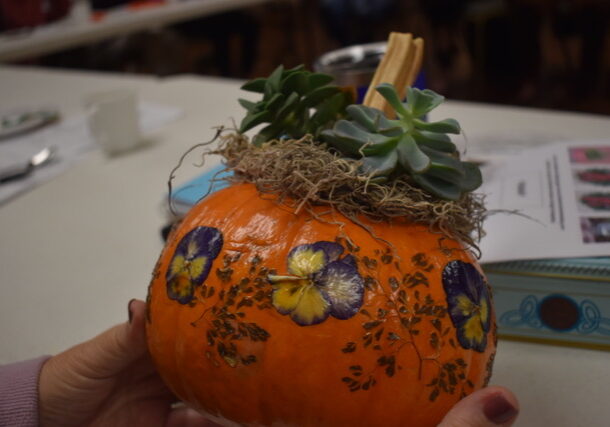 Garden Pansy flower decor on a pumpkin